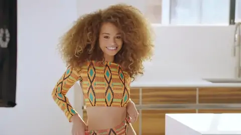 Nubile dark-hued with wavy hair is railing a massive knob on the sofa