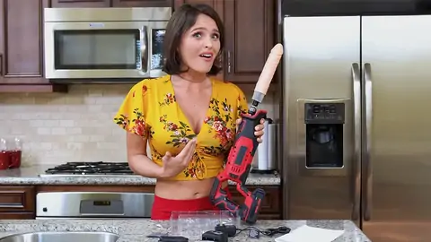 Prepping to smash the dark-haired honey with a machine